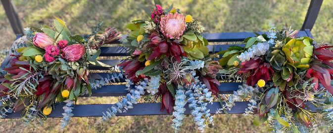 3 native bouquets on bench